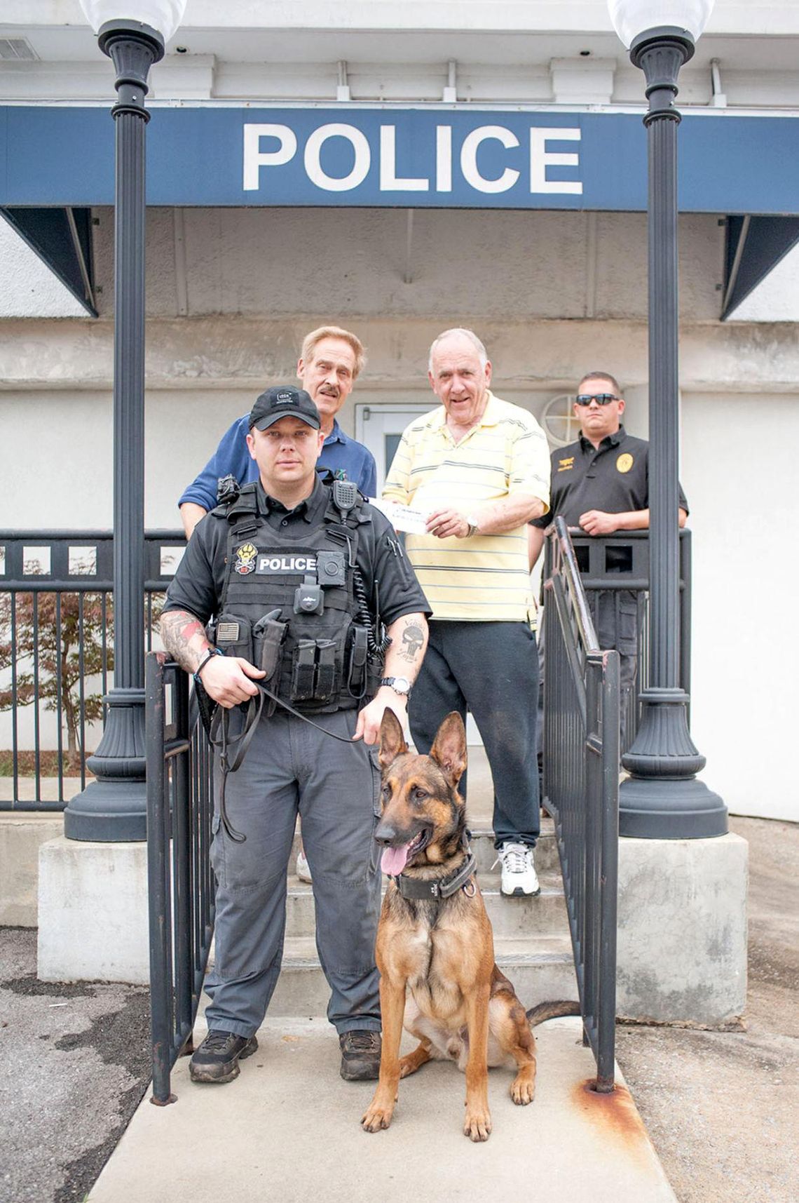 Officer Daniel Chesser, front, with his police dog, Andor, in Talladega, Alabama, in 2015. 
