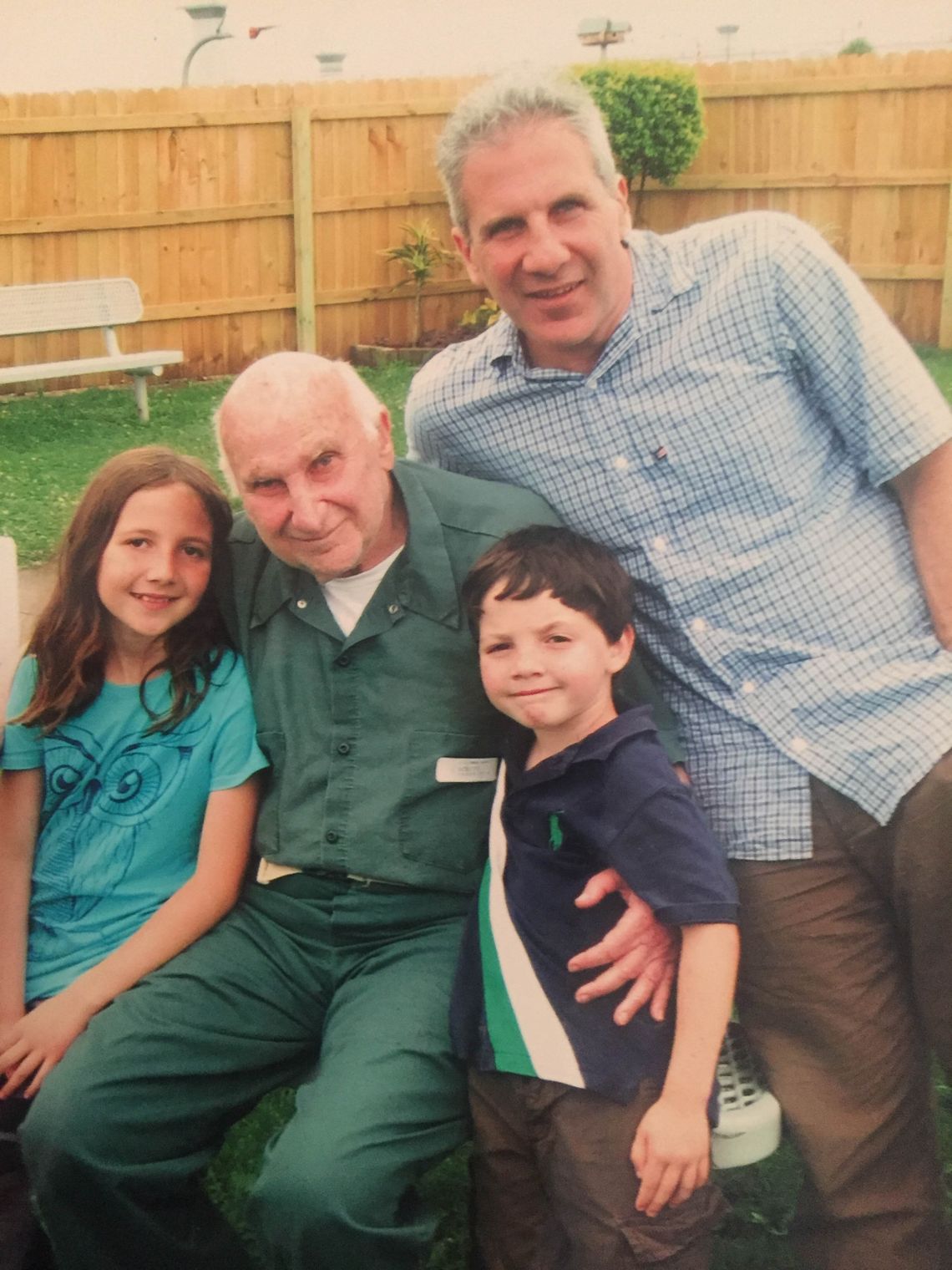 Irwin Schiff with his son, Andrew, and his grandchildren, Eliza and Ethan, in Terre Haute penitentiary in Indiana around 2010. His family tried and failed to secure his release for two years. He died of lung cancer in prison in 2015 at the age of 87.