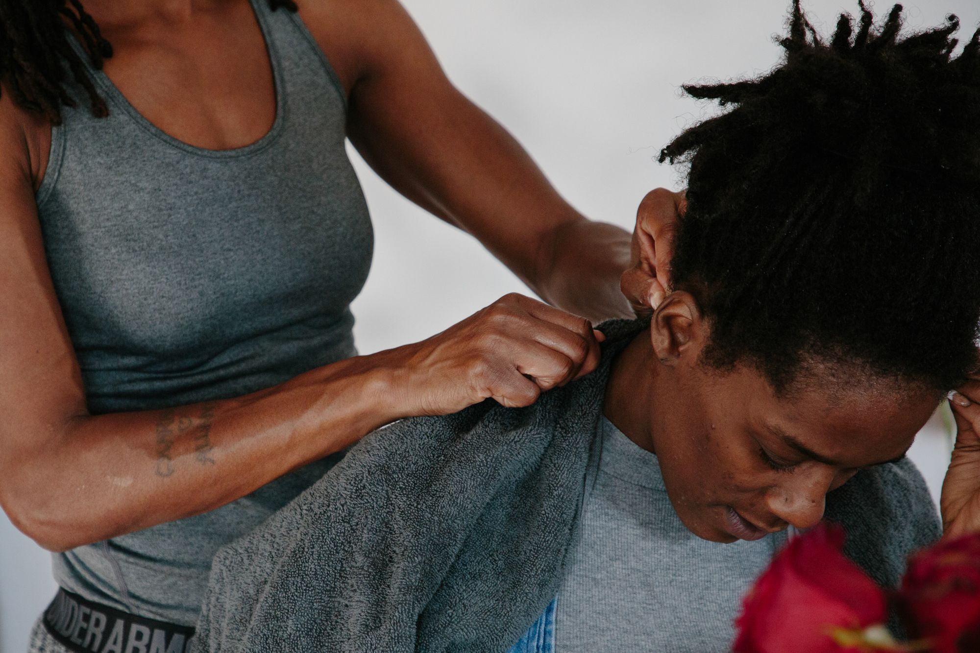 Sitting at a kitchen table, Chaney gets her hair done by her mother, Lashonia Thompson-El (left), on Dec. 12, 2020. Since Thompson-El’s return in 2011, the two have worked to build a relationship and make memories they didn’t get to make when Chaney was a young girl. 