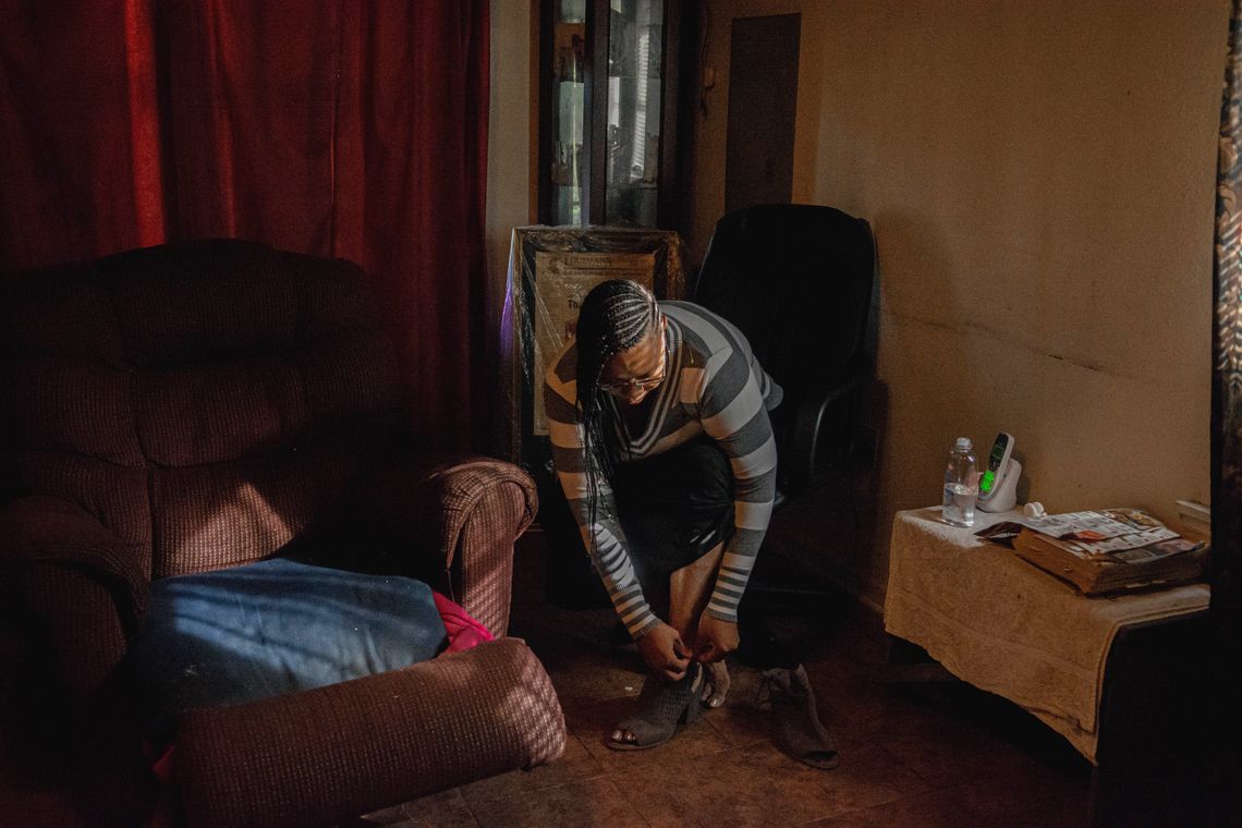 Hayes puts on her ex-husband's favorite shoes at her home as she prepares to go visit him at The Louisiana State Penitentiary. 