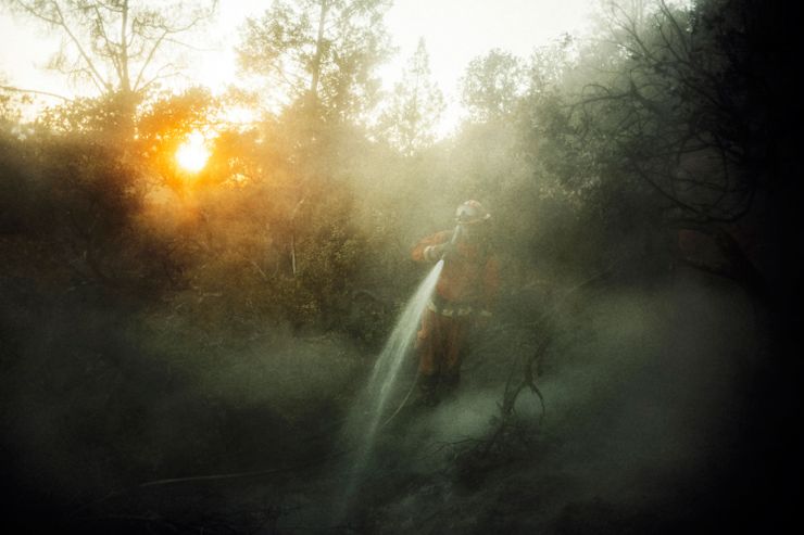 Eduardo Amezcua, an inmate firefighter from the Antelope Conservation Camp mops up hot spots during the wildfires that devastated large swaths of California’s wine country in Sonoma County. Roughly 3,800 inmates in the state’s prison system are on the front lines of active wild fires this fall.