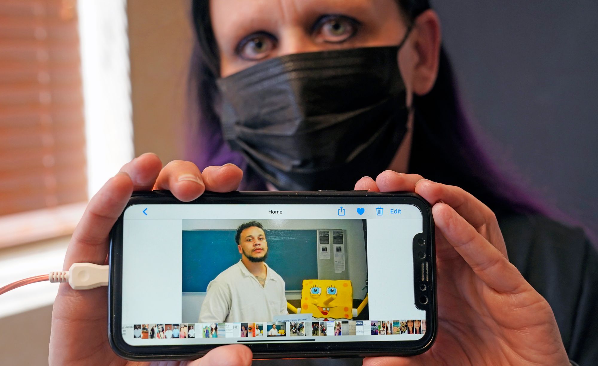 Carrie Shipp shows a photo of her 21-year-old son Matthew Shipp, who is incarcerated in Texas and decided not to get vaccinated out of fear and distrust of prison medical staff. 