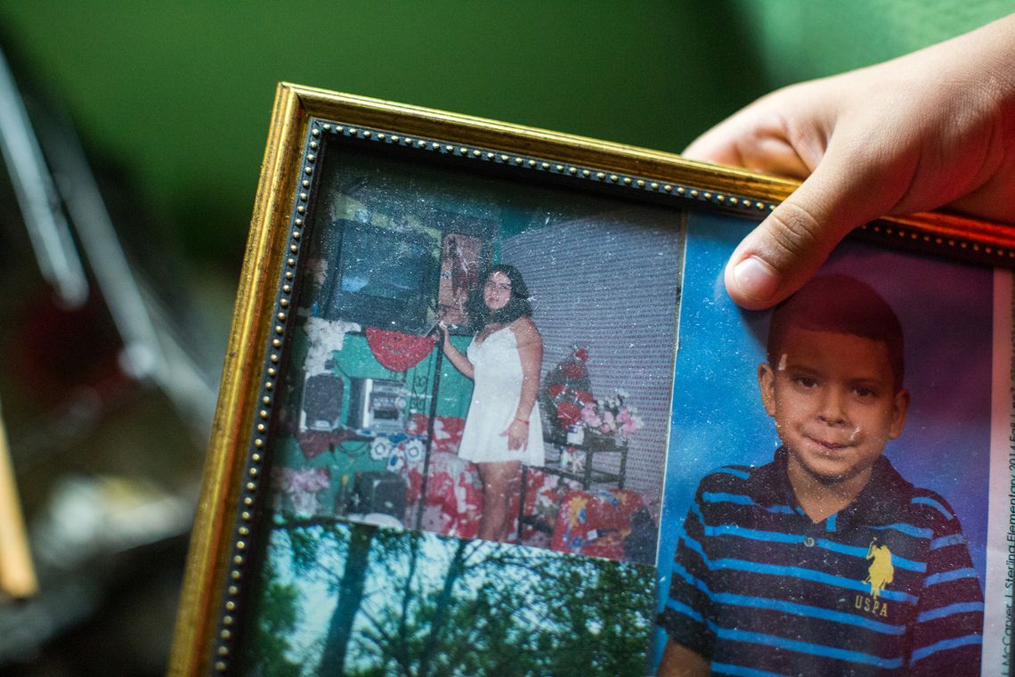 A photo of Arita from when she was living in Honduras, next to a school photo of her son, Amilcar. 