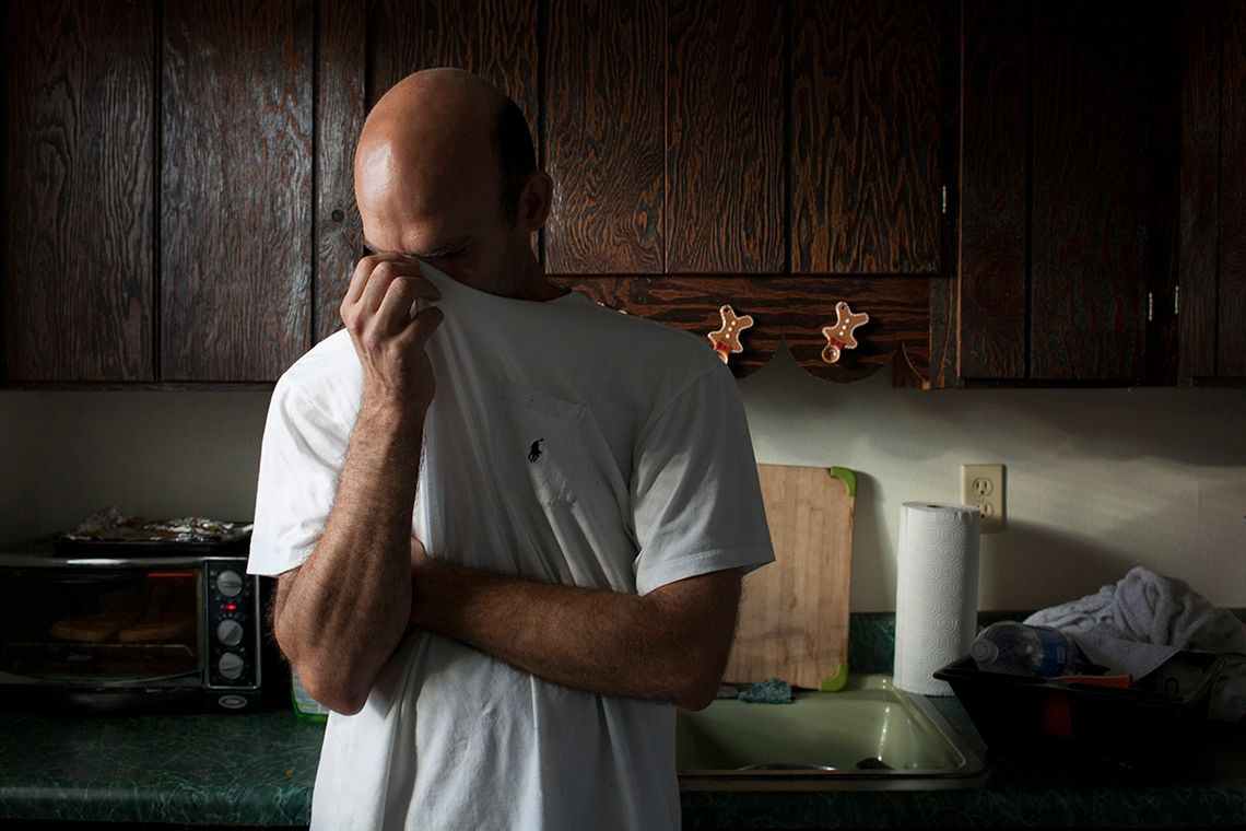 Richard in his kitchen. He writes, “I logged onto Yahoo IM, looking for anyone to chat with. By anyone, it usually meant someone female.”
