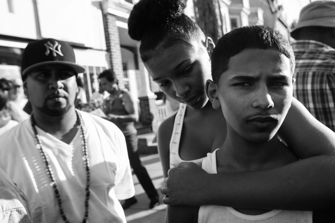 Brooklynn Bailey, 13, embracing 14-year-old Nasser Alradaer on Aug. 11, 2011. Alradaer’s uncle, Norman Alhout, was murdered that year in the grocery store he owned in the Browntown neighborhood of Wilmington, Del.