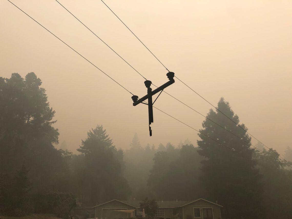 The remains of a burned power pole, off Molina Drive in Bonny Doon, California, on August 22, 2020.