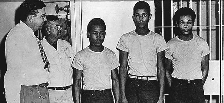 From left, Sheriff Willis McCall, jailer Reuben Hatcher, Walter Irvin, Charles Greenlee and Samuel Shepherd, at the Lake County Jail in 1949.