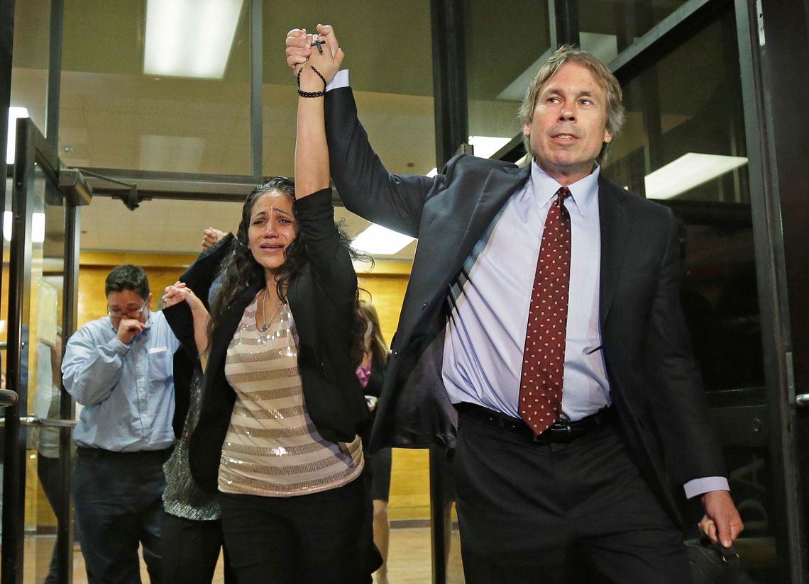 Cassandra Rivera, center, followed by Elizabeth Ramirez and Kristie Mayhugh, leave the Bexar County Jail with their attorney Mike Ware, right, on Monday, Nov. 18, 2013. 