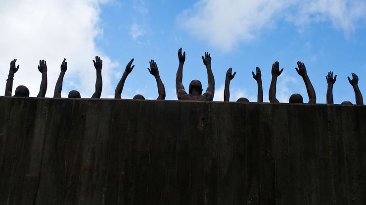 A bronze sculpture called “Raise Up” at the National Memorial for Peace and Justice in Montgomery, Ala.