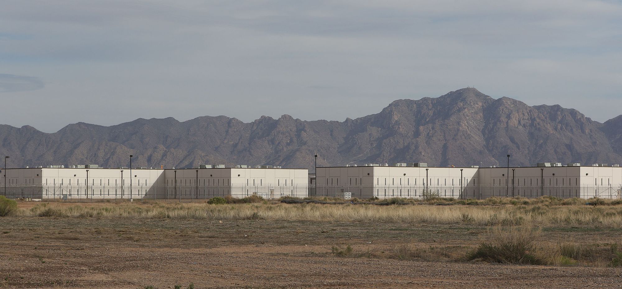 Saguaro Correctional Facility CCA Fence CCA mountains Eloy Arizona1