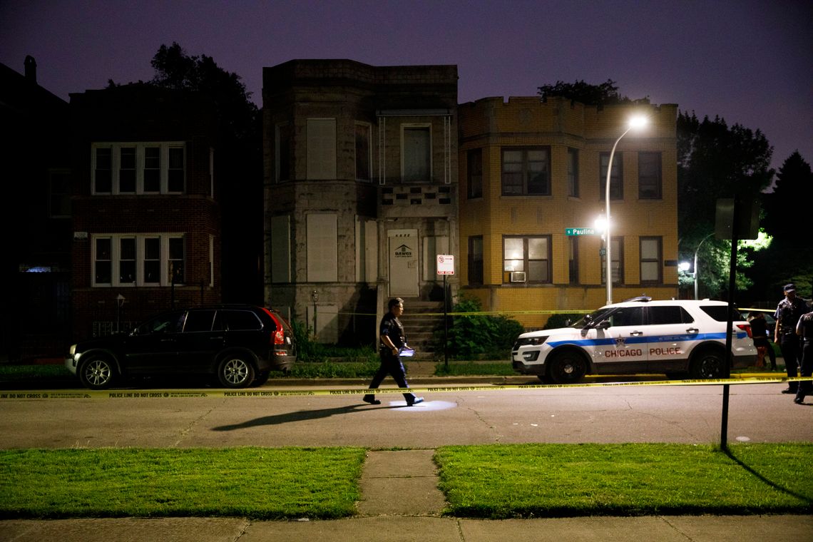 The police at the scene where four people were shot in Chicago in July 2019.