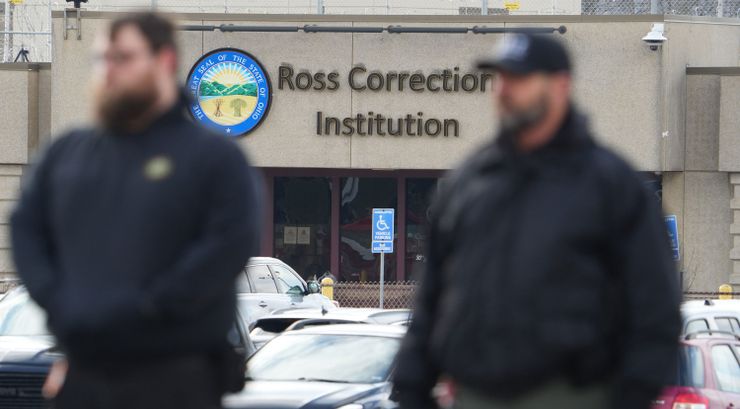 Ohio Department of Rehabilitation and Correction staff members gather on Jan. 3 for Andrew Lansing’s funeral procession as it passes by Ross Correctional Institution. Authorities say Lansing, a correctional officer, was killed by an incarcerated man last month.