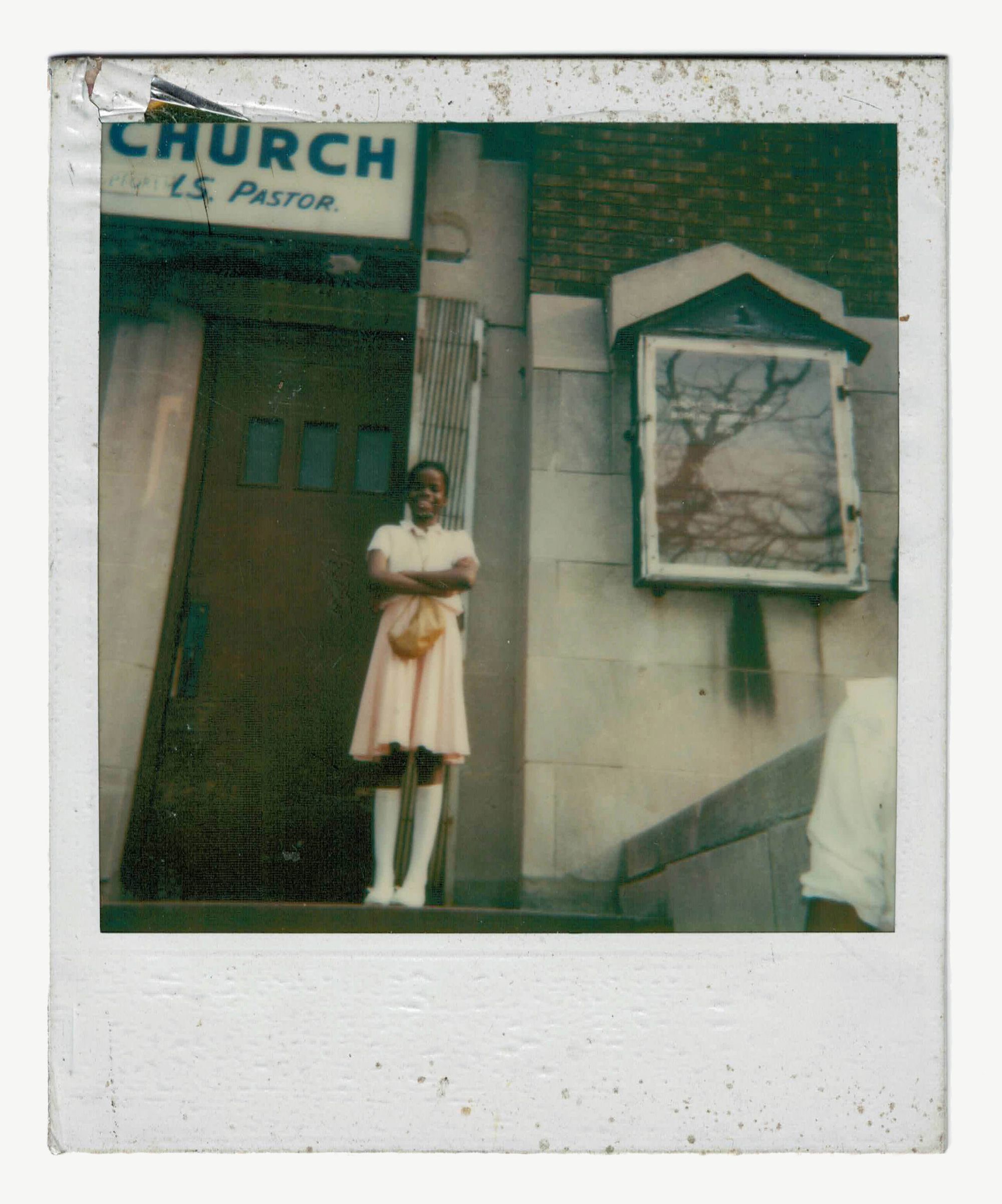 Outside her grandmother’s church at 11 years old.