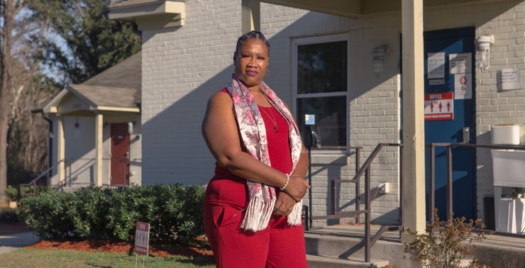 Nacola McNeil in front of the Leading Into New Communities (LINC) transitional housing in Wilmington, NC, in January.