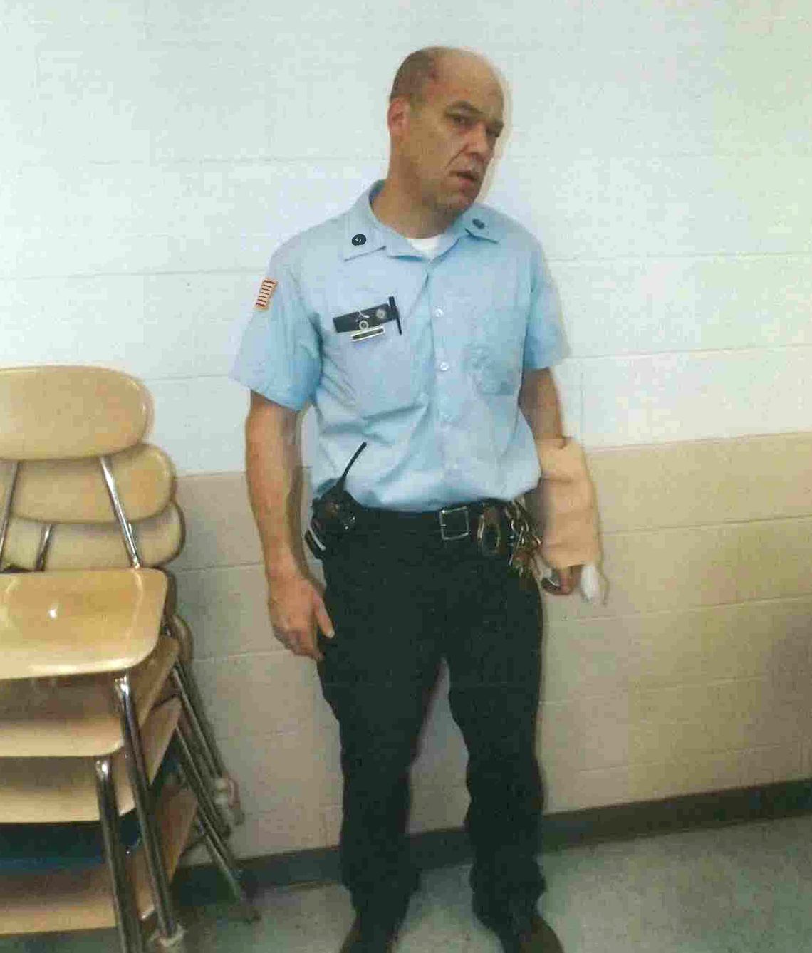 A photo of former correctional officer Bruce Tucker at Sullivan Correctional Facility shortly after Karl Taylor died, introduced as evidence in court. An ice pack is wrapped around his left arm, which was broken in the altercation with Taylor.