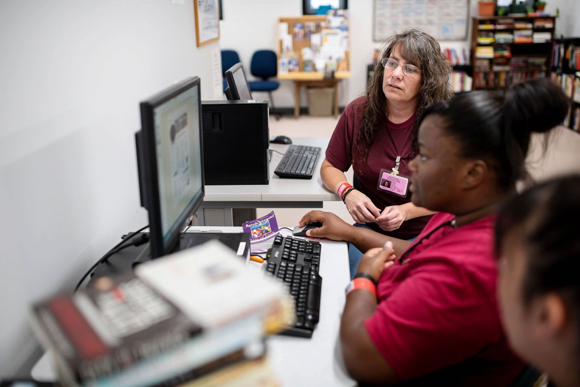 From left, prisoners Deborah Ranger, Robin Ledbetter and Rebekah Robinson work in the jobs center in the WORTH unit at York Correctional Institution in August.