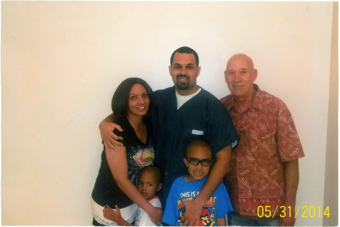 Jasmine, Josiah, Justus, and Lima-Marin’s father, Eliseo, right, during a prison visit in 2014.