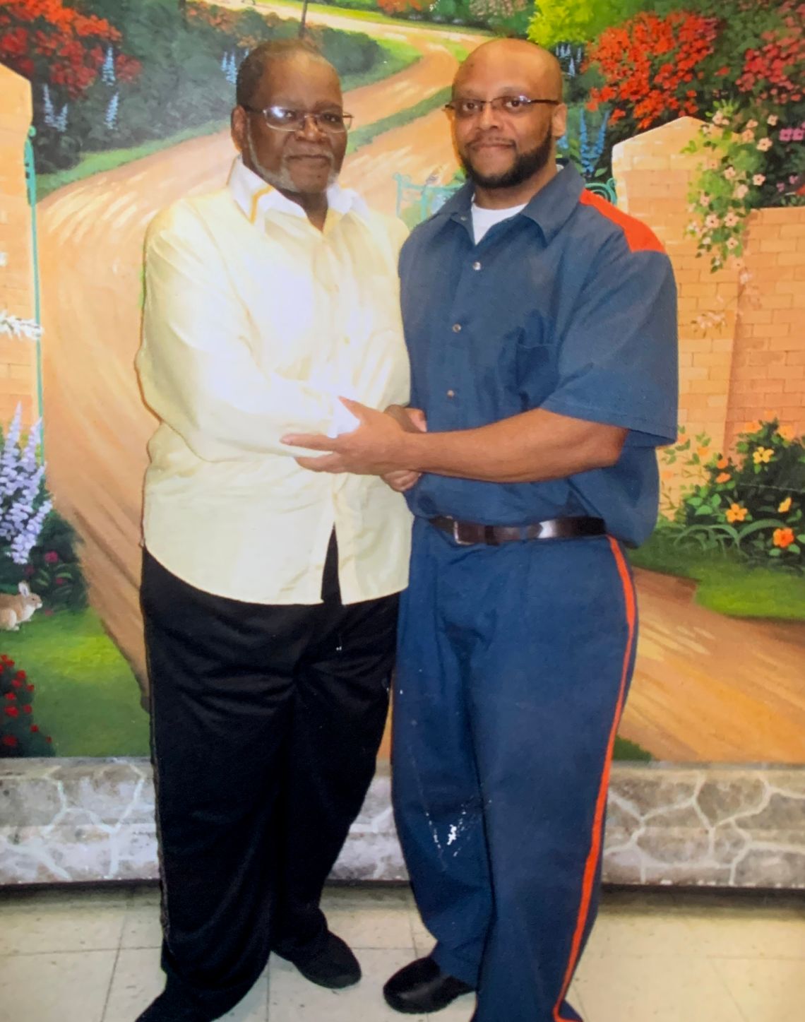 Yusef Qualls with his father, Elder Qualls, in 2017.