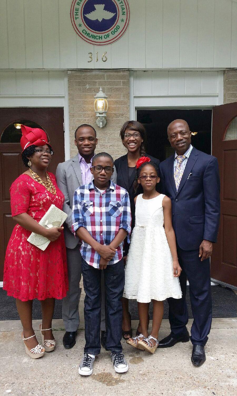 Okperuvwe, right, with his wife and children at church. 