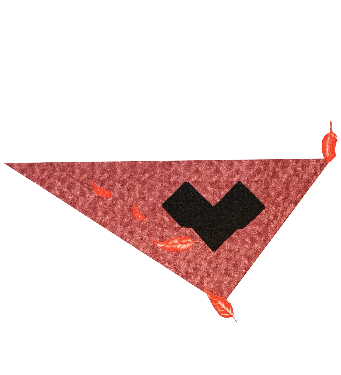 A photo of a pink, triangle-shaped piece of a quilt has a heart shape in black in the center, and some red leaves at the edges and within the quilt triangle.