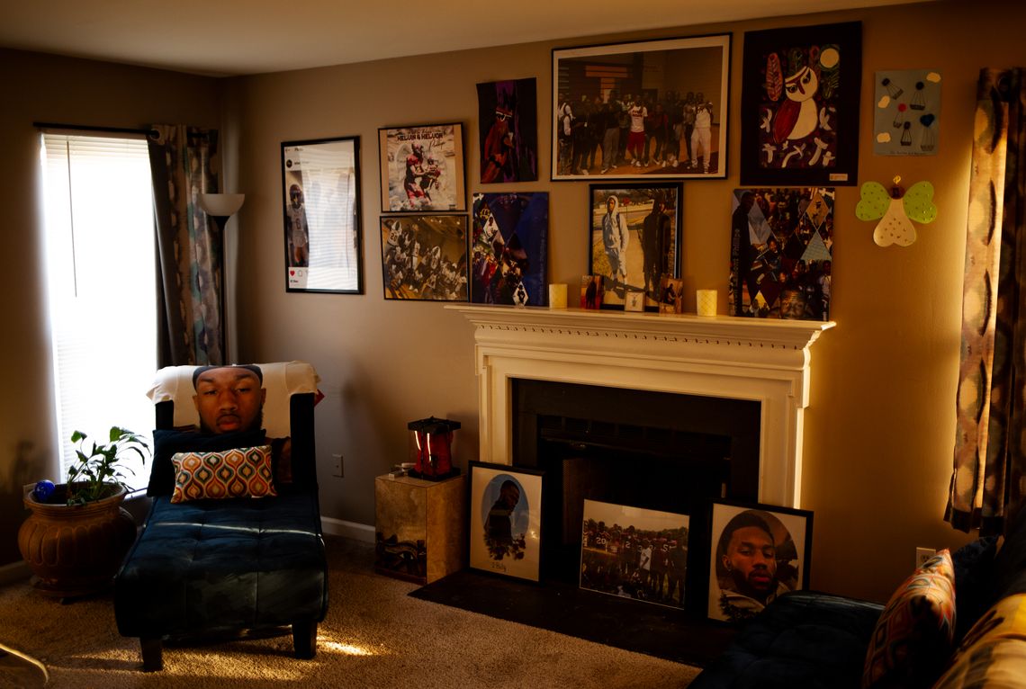 Angel Mays’ former living room has nine frames with art and photos hanging on the wall and three in front of the fireplace. Some of the photos show Kelvin Phillips, her son.