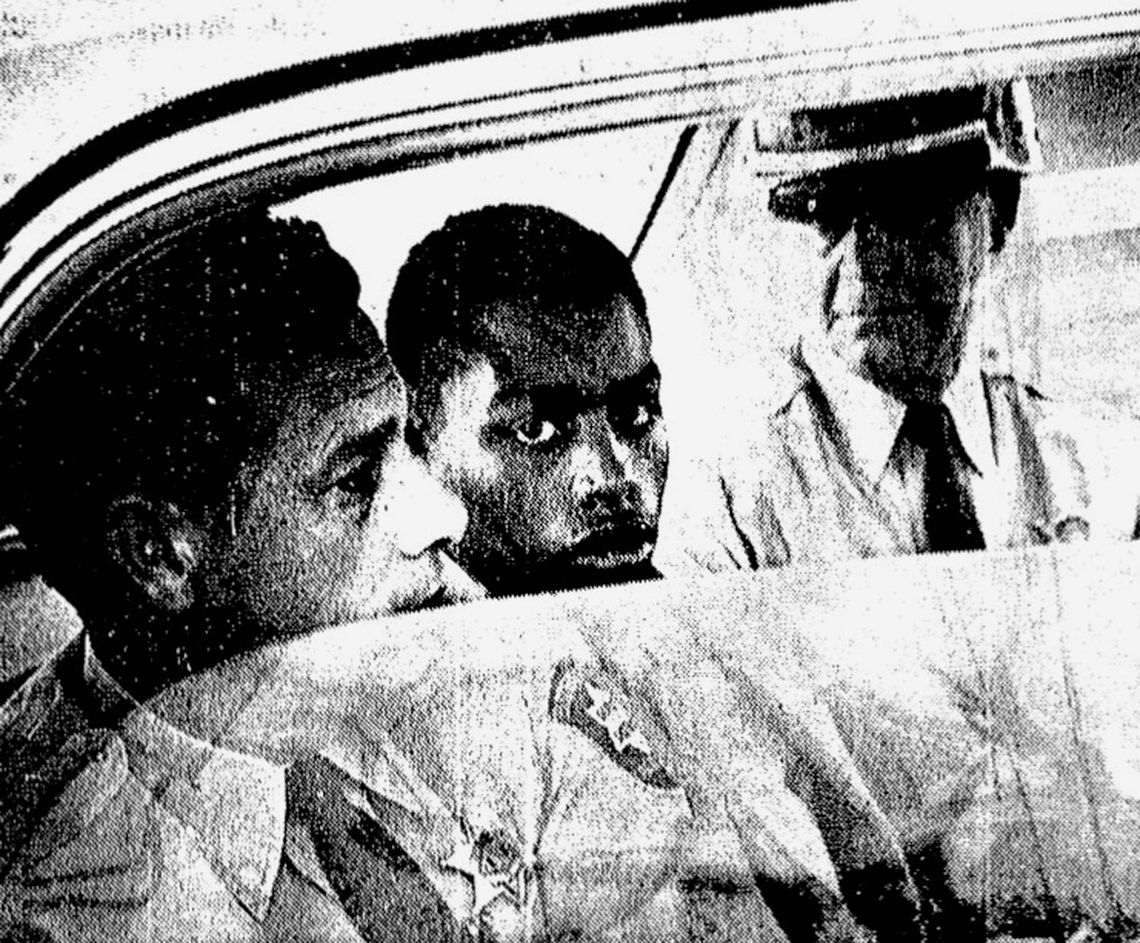 Henry Montgomery, flanked by two deputies, awaits the verdict in his 1964 trial for the murder of Deputy Sheriff Charles H. Hurt in Louisiana. 