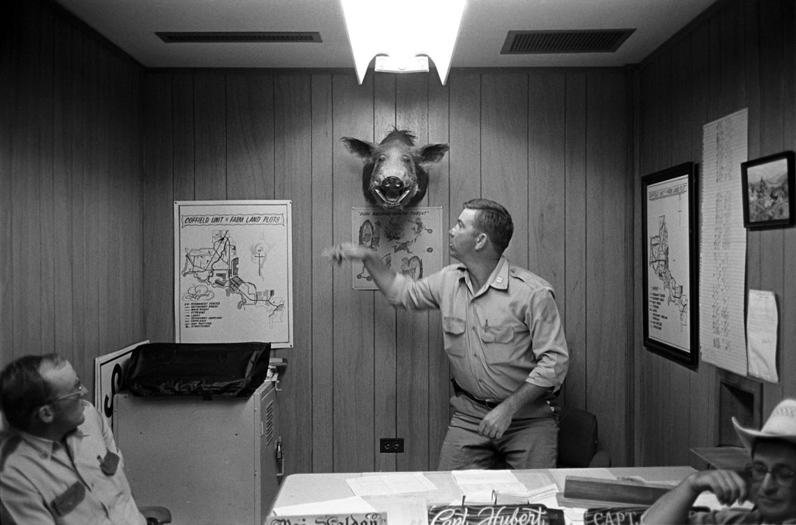 A building captain punching a hog head at the H.H. Coffield Unit in Tennessee Colony, Texas in 1978.