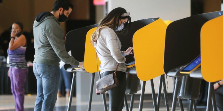 Voters marked their ballots on the first weekend of early in-person voting on October 25 in Los Angeles, Calif.  