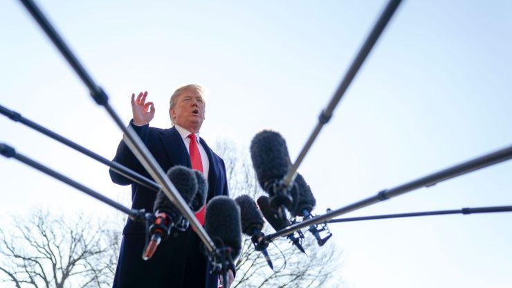 President Donald Trump speaks to reporters on the South Lawn of the White House.