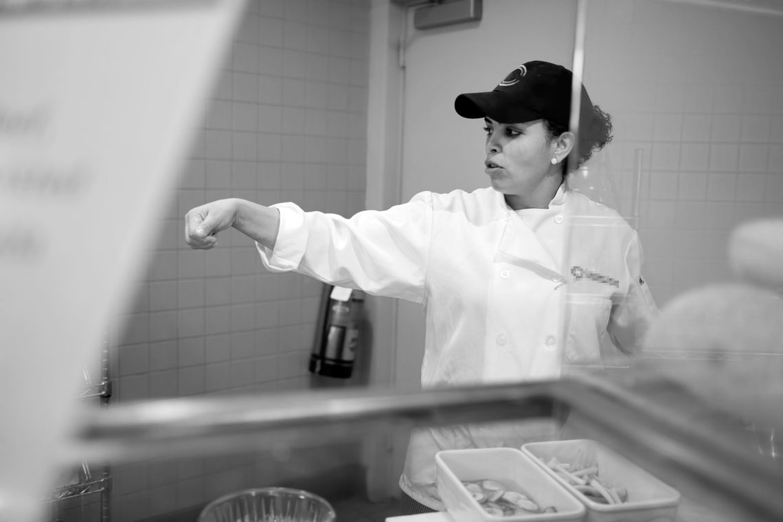 Evelyn at work in the cafeteria of the World Financial Center in Manhattan. 