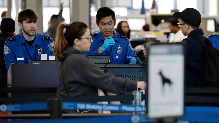 Federal Transportation Security Administration officers work at a checkpoint at O’Hare airport in Chicago, in January.