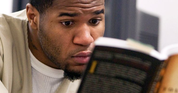 Michael Bennett reads a book at the Cheshire Correctional Institution in Connecticut, in 2010. 