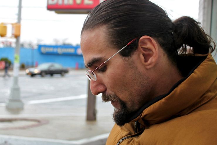 Yantz taking a smoke break in December, not far from the three-quarter house where he’s lived since his release. 
