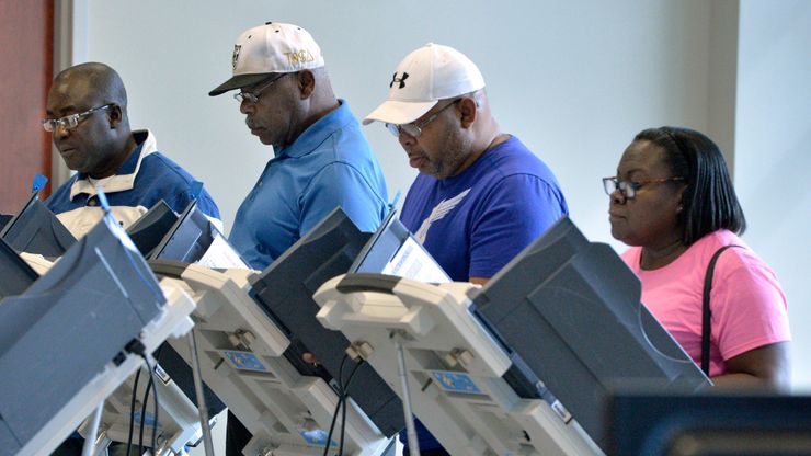 Citizens cast their ballots during early voting at the municipal building in Augusta, Ga., in October. 