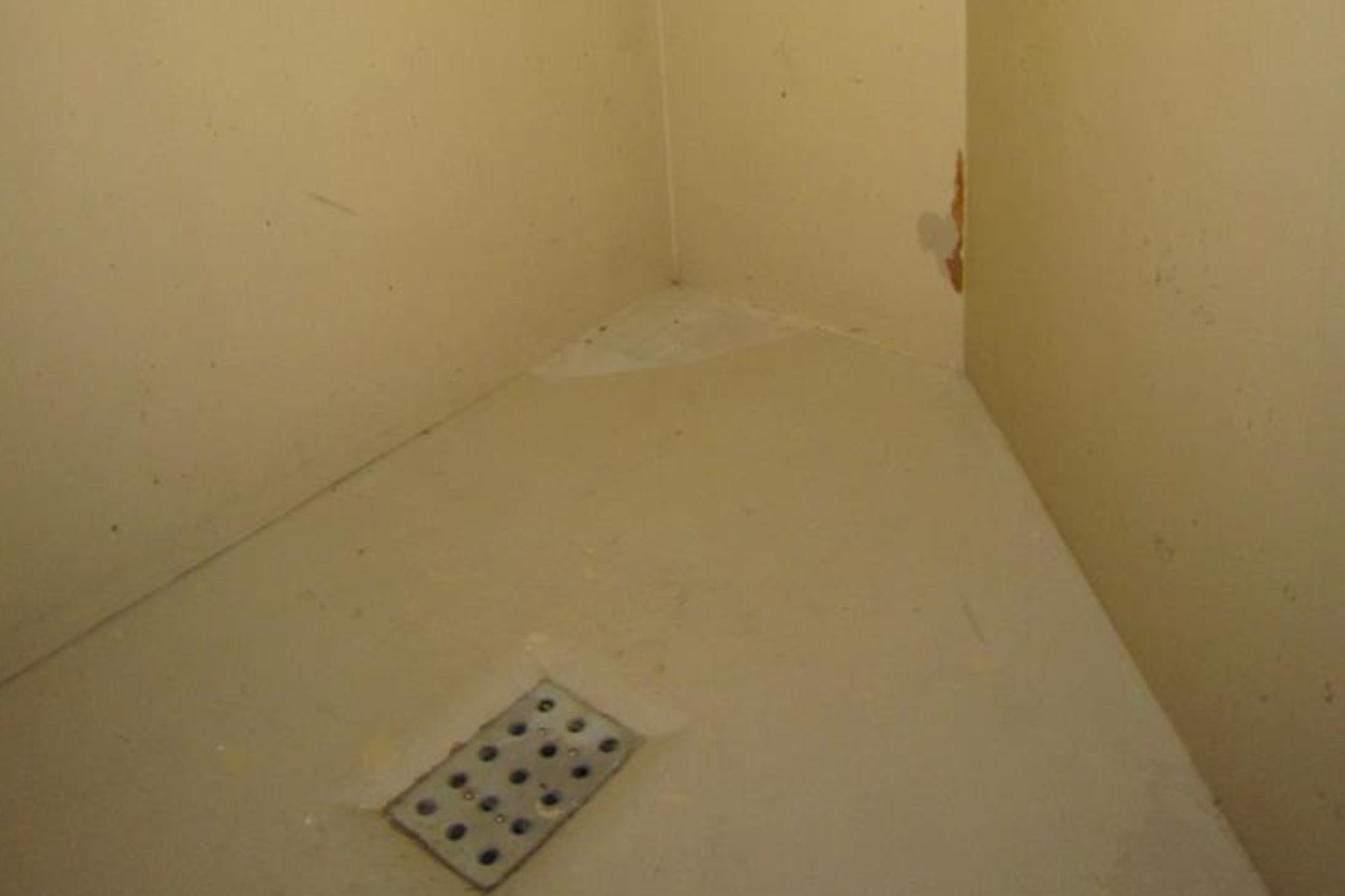 A “safety cell” at the Sacramento County Main Jail, which is used to hold people at risk of suicide or in need of psychiatric treatment. The grate in the floor serves as a toilet. 