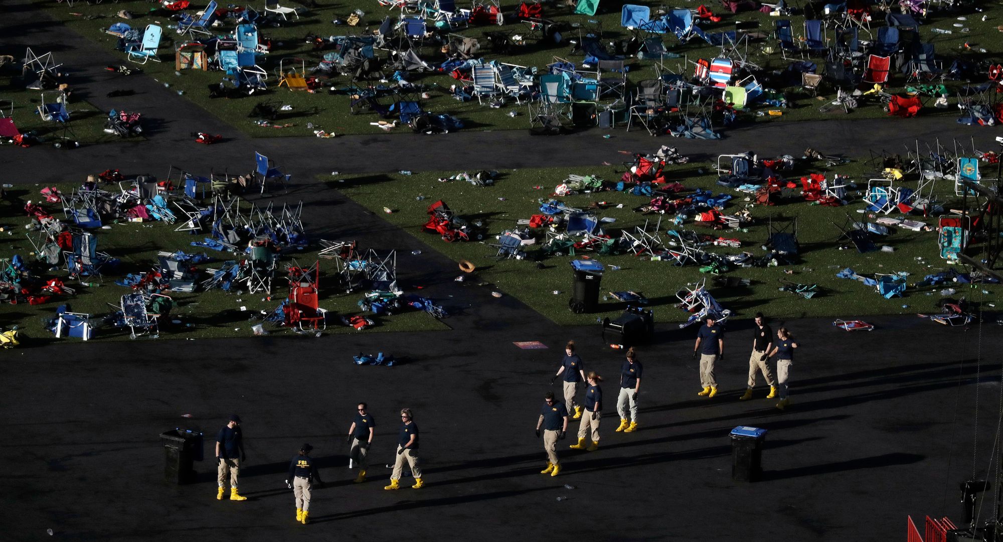 Investigators work at a festival ground across the street from the Mandalay Bay Resort and Casino in Las Vegas, where Stephen Paddock opened fire on an outdoor music concert. 