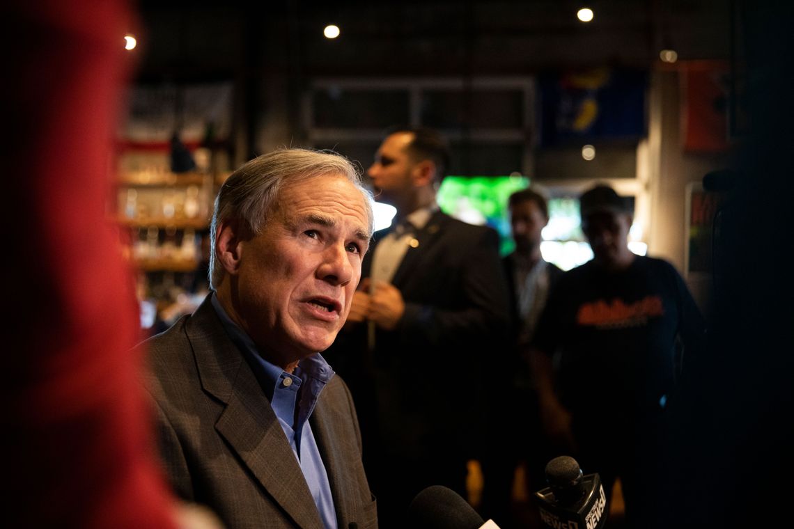 Gov. Greg Abbott speaks to reporters at University Draft House in Edinburg, Texas.