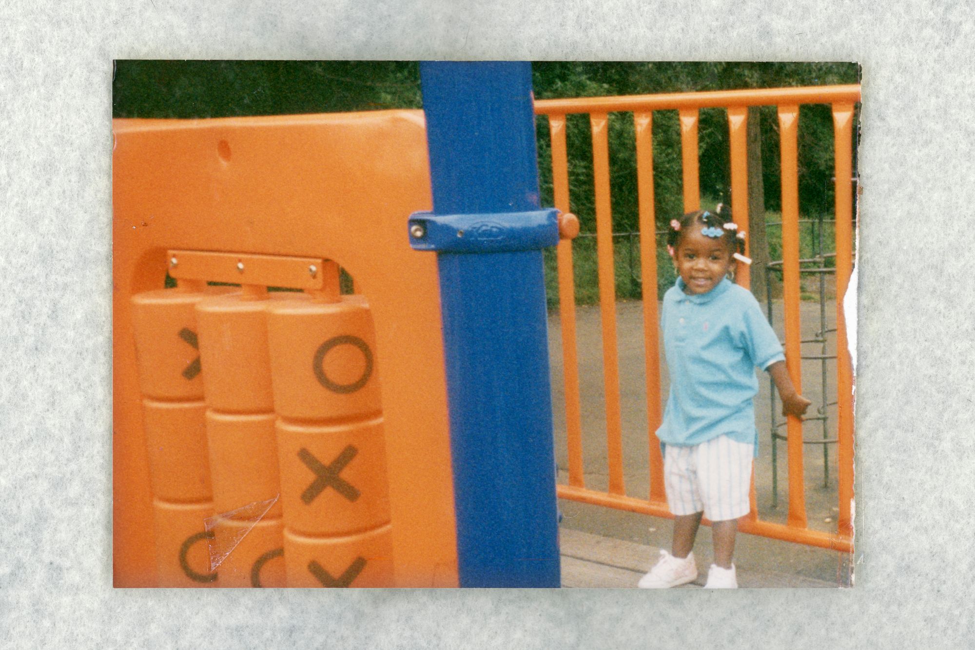 In an archival image, 2-year-old Chaney clings to the bars on a swingset in a park near her home in Washington, D.C. 