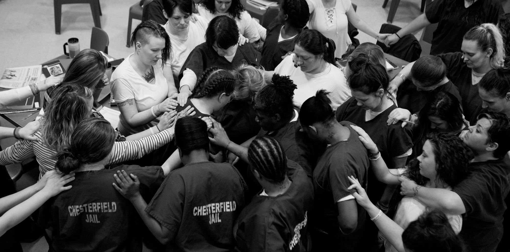 Members of the Heroin Addiction Recovery Program at the Chesterfield County Jail in Virginia pray for a participant as she was preparing to be released in November of 2017.