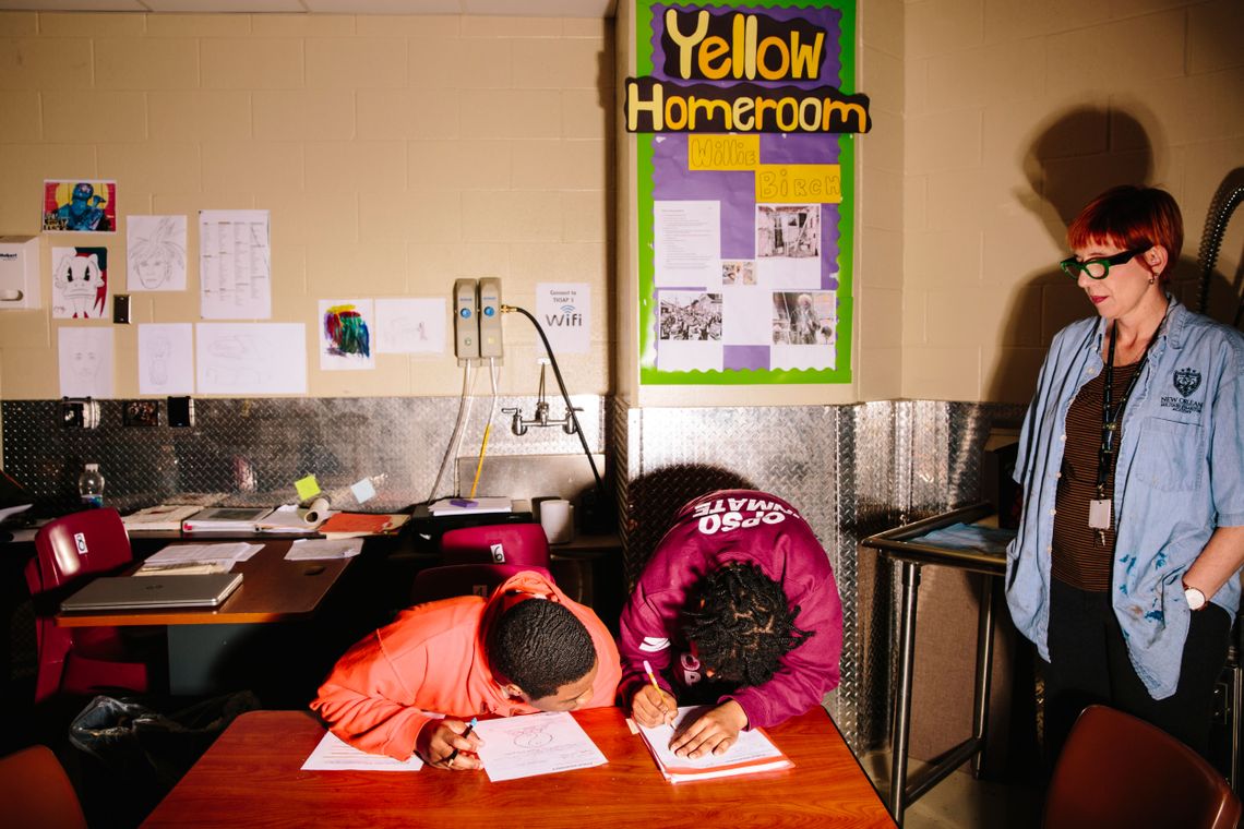 Art teacher Patricia Laing supervises students as they draw proposals for monuments to replace Confederate statues removed from New Orleans last year.