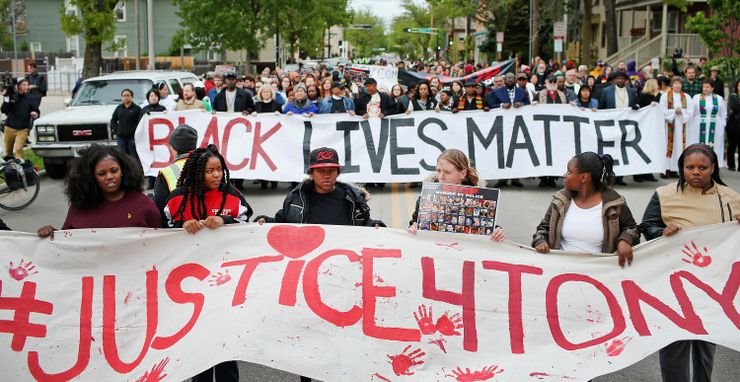 Protesters march in Madison, Wisc. on May 12, after it was announced there would be no charges filed against Officer Matt Kenny in the shooting death of 19-year-old Tony Robinson.