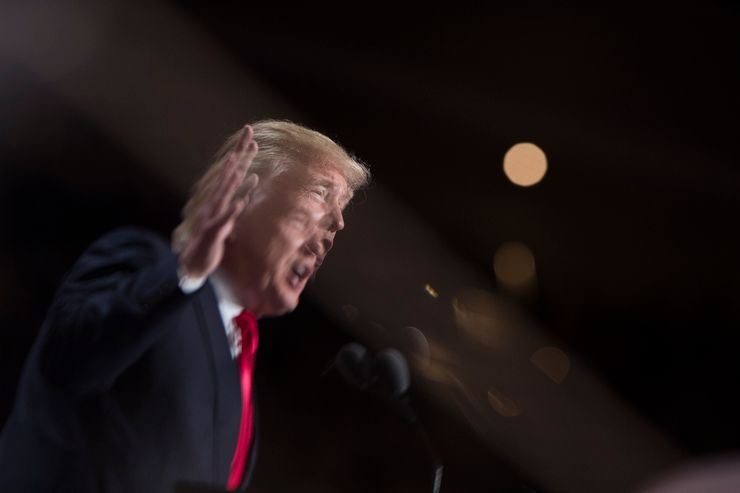 Republican presidential candidate Donald Trump is reflected in glass as he speaks the final night of the Republican National Convention.