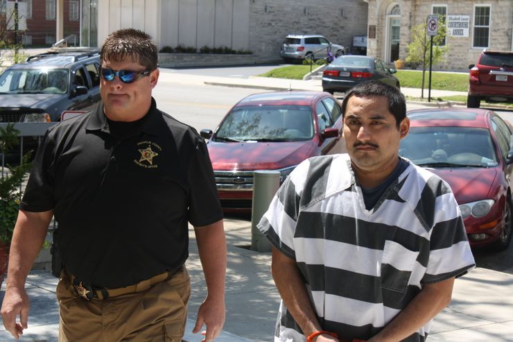 Angel Campos Nava, right, was brought to the Franklin County Courthouse in Russellville, Ala. in April, 2013.