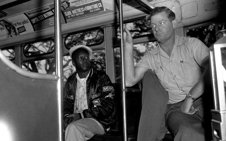 A bus driver asks a black passenger to move to a seat in the back of the bus in Tallahassee, Fla in 1956. 