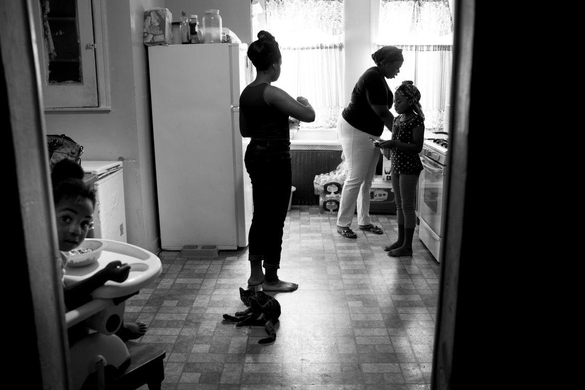 Keisha Boone makes breakfast for the six children she looks after on Aug. 10, 2013. Keisha is one of many single mothers living in Camden. Her first husband was shot and killed, and the father of her youngest child is in jail. 