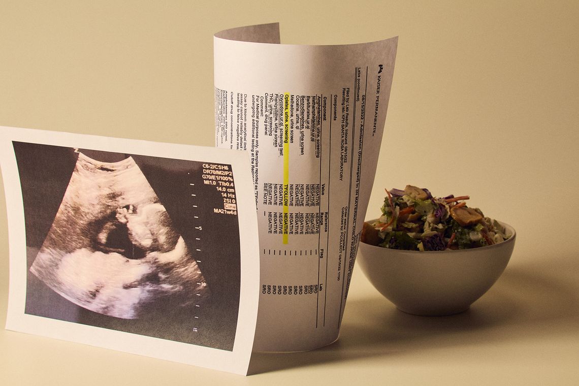 Three items are arranged on a white surface: a salad in a white bowl, a copy of a sonogram, and a printout of a false positive drug test result.