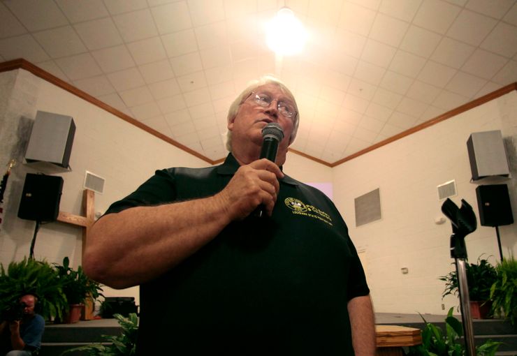 Louisiana State Penitentiary warden Burl Cain delivers remarks prior to the screening of the documentary ‘Serving Life,’ by director Lisa R. Cohen, inside the prison chapel in Angola, La.,  Thursday, July 21, 2011. The film is about the volunteer hospice work done by inmates for inmates dying in the prison. (AP Photo/Gerald Herbert)