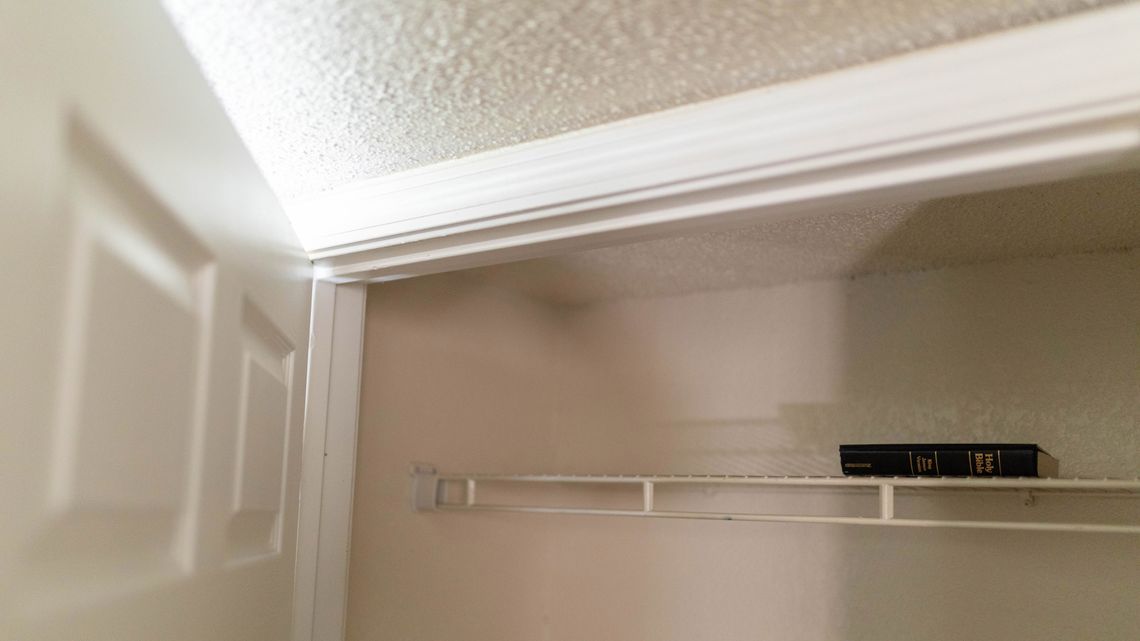 Top: Cynthia Atchison and Jimmy Hill, mother and father of Jimmy Atchison, who was unarmed and hiding in a closet when he was killed by an Atlanta police officer who was part of the FBI’s Atlanta Metro Major Offender task force. Jimmy in family photos. Bottom: The closet where he died.