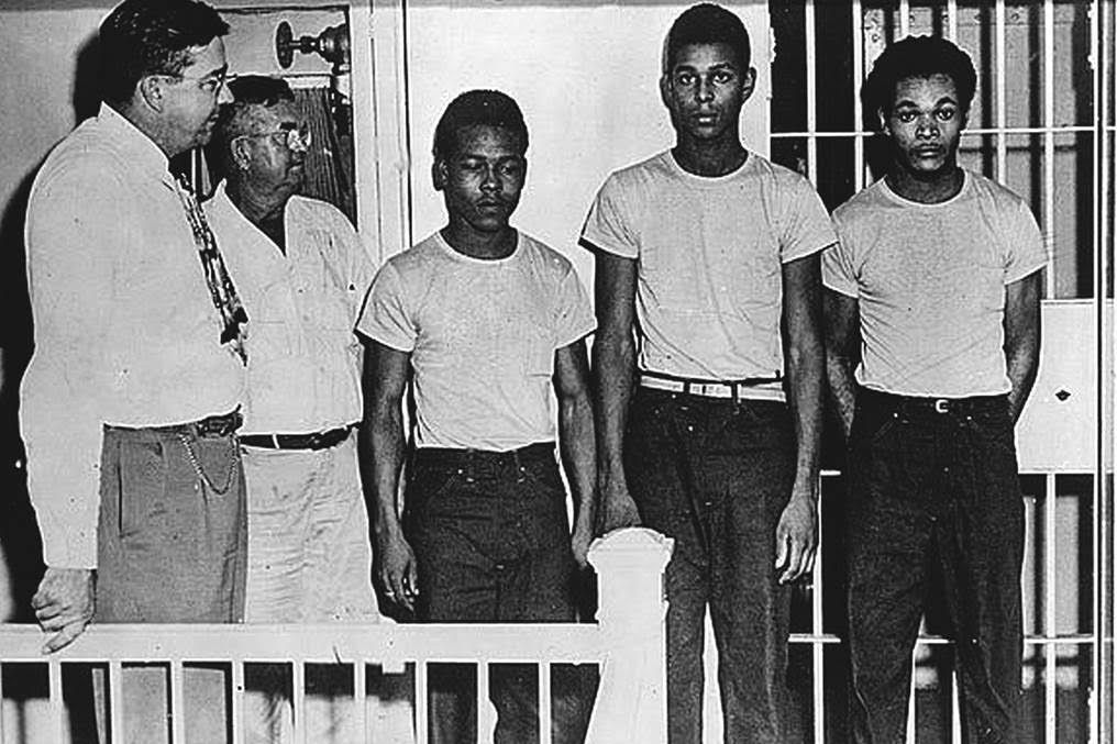 From left, Sheriff Willis McCall, jailer Reuben Hatcher, Walter Irvin, Charles Greenlee and Samuel Shepherd, at the Lake County Jail in 1949. 