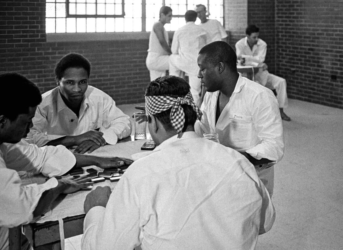 Clarence Jordan, facing camera at the table in the foreground, played games with other prisoners on Texas's death row in 1979.
